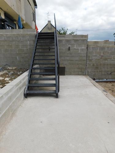 a stairway leading up to a building at Tsara Home in Le Trait