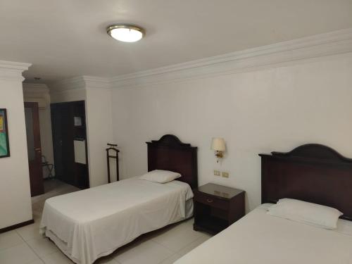 Katil atau katil-katil dalam bilik di Ex Hotel Asturias Centrico