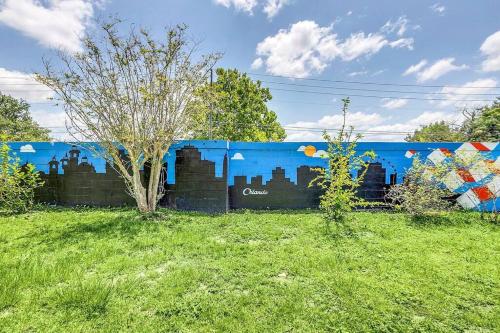 a blue building with a mural on the side of it at Tranquil Oasis 4BR Pool Home in Orlando