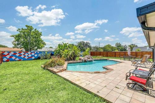 a swimming pool in a yard with a patio at Tranquil Oasis 4BR Pool Home in Orlando