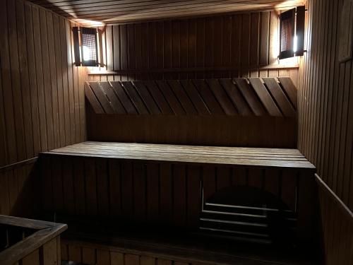 an empty sauna with a wooden floor and lights at Готельно-ресторанний комплекс Б-52 in Kyiv