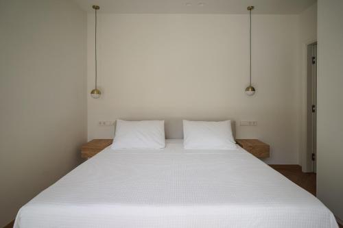 Ένα ή περισσότερα κρεβάτια σε δωμάτιο στο Plaka House - Boutique Apartments