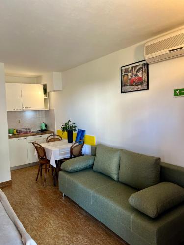 a living room with a couch and a table at Rubin Jelsa in Jelsa