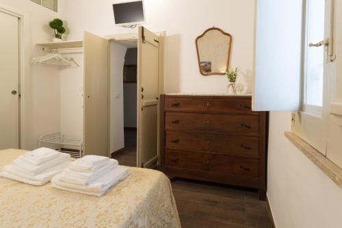 Postel nebo postele na pokoji v ubytování Sotto il Campanile