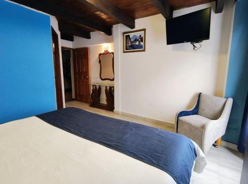 Ένα ή περισσότερα κρεβάτια σε δωμάτιο στο Hotel Barrio Antiguo