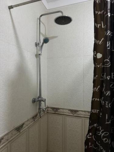 a shower in a bathroom with a shower curtain at Appartment for rent in Ferizaj