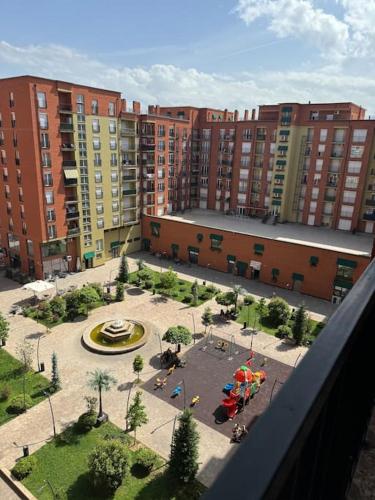 a view of a courtyard in a city with tall buildings at Appartment for rent in Ferizaj