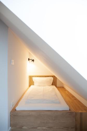 Una cama o camas en una habitación de Mlino Alpino