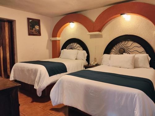Ένα ή περισσότερα κρεβάτια σε δωμάτιο στο Hotel Barrio Antiguo