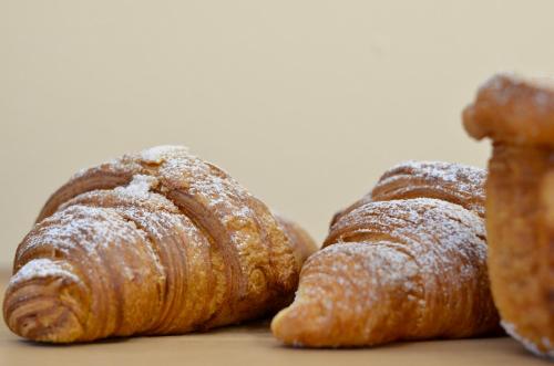 a group of three pastries sitting on a table at Il Fico Lake Iseo b&b in Pilzone