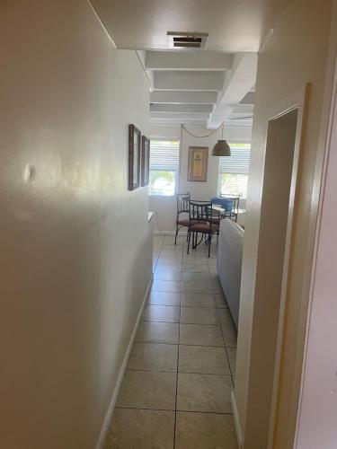 a hallway with a living room and a dining room at Venice Beach Villas in Venice