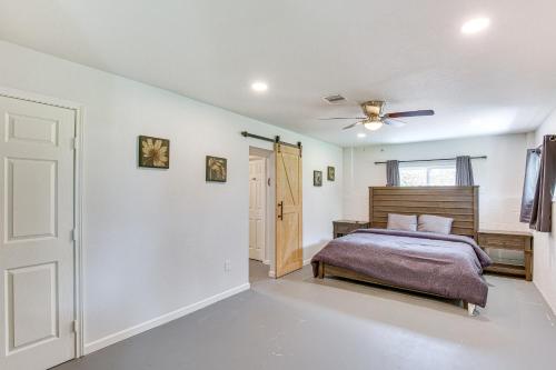 a bedroom with a bed and a ceiling fan at Granbury Home with Lake Views about 6 Mi to Boat Launch! in Granbury