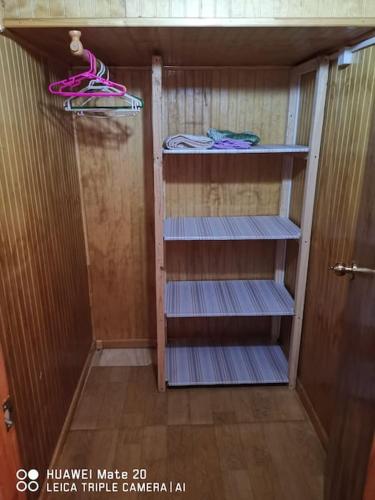 a small room with shelves in a sauna at Cabaña, excelente ubicación in Puerto Montt