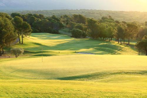 a view of a golf course with a green at Le Domaine de Saint Endreol Golf & Spa Resort in La Motte