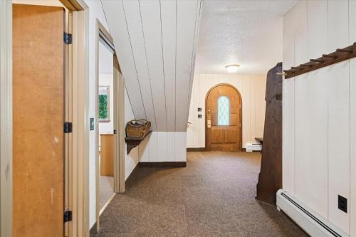 a hallway of a house with a door and a room at 4-Bedroom Townhouse with Sauna Snow Flurry in Killington