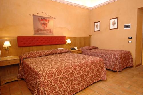 Letto o letti in una camera di Casale Certosa