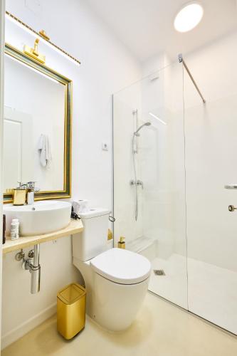 a bathroom with a shower and a toilet and a sink at Carol Park View in Bucharest