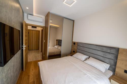 Letto o letti in una camera di New City Luxury Apartments