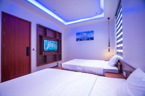 Ένα ή περισσότερα κρεβάτια σε δωμάτιο στο Villa HOÀNG GIA