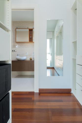 a bathroom with a sink and a mirror at Villa Helios Aguadulce Almeria in Roquetas de Mar