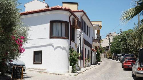 a white building on the side of a street at Pikan Ephesus in Selcuk