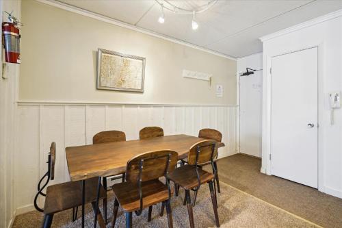 a conference room with a wooden table and chairs at 3-Bedroom Condo Ski-In, Shuttle, and Cozy Fireplace Whiffletree I3 in Killington
