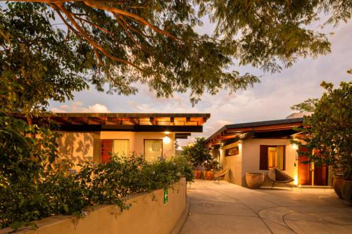 a house with a courtyard in front of it at Welcome to Paradise - Luxurious 2 Bedroom Oasis with Pool and Lush Tropical Garden in Sayulita