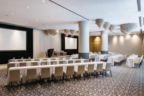 a conference room with rows of tables and chairs at The St. Regis Mexico City in Mexico City