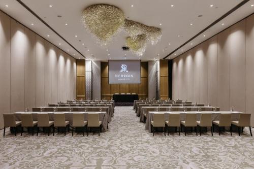 a conference room with chairs and a projection screen at The St. Regis Mexico City in Mexico City