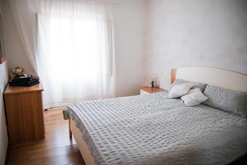 Postel nebo postele na pokoji v ubytování Le Chevalier Apartment