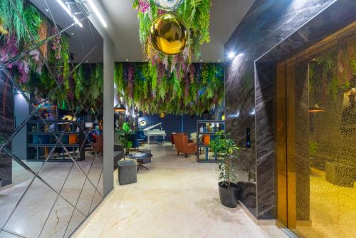 a room with plants hanging from the ceiling at Gori Apartments in Gori