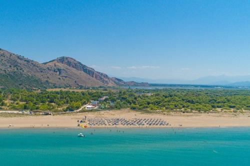 a view of a beach with mountains in the background at Beautiful village house in Metóchion