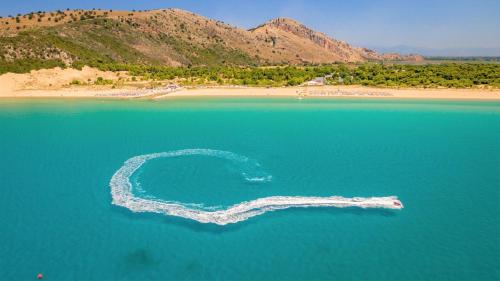an island in the middle of a body of water at Beautiful village house in Metóchion