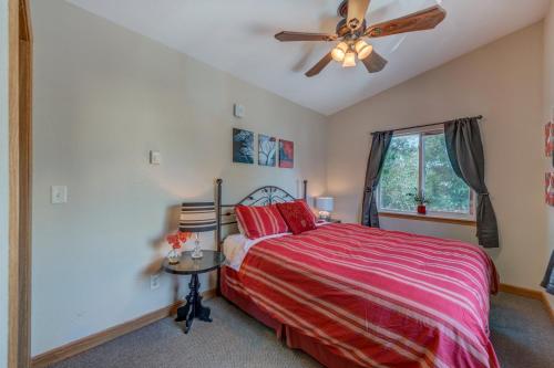 a bedroom with a bed and a ceiling fan at Moonbeam Condo - Beautiful 2 Bedroom Stay by Beach in Pepin