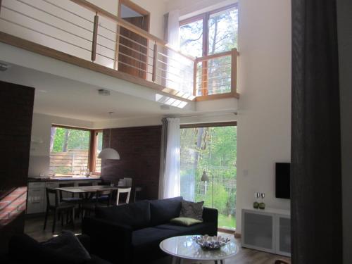 a living room with a couch and a table at Amadea in Łukęcin