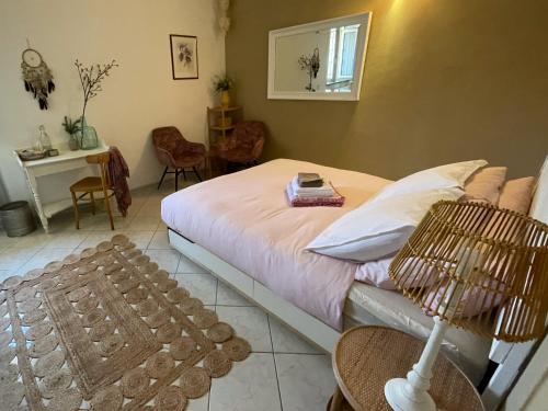 a bedroom with a bed and a table and chairs at B&B La Vera Vita in Troviggiano
