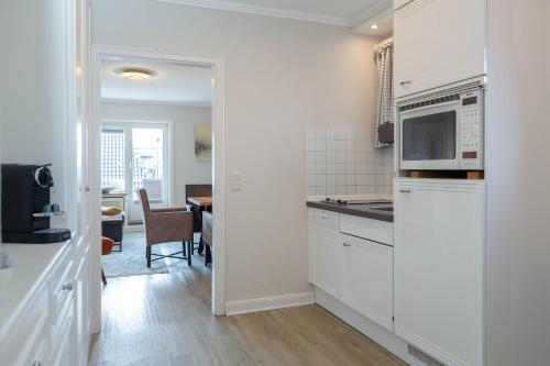 Kuchyň nebo kuchyňský kout v ubytování Strand Loft