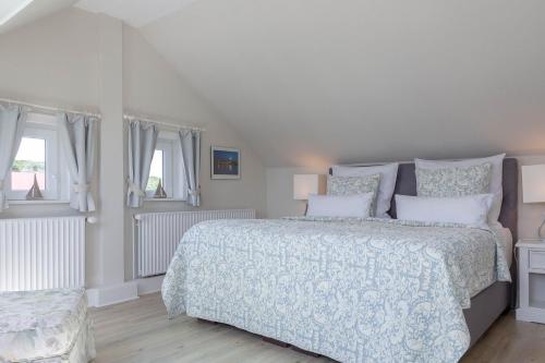 Voodi või voodid majutusasutuse Strand Loft toas