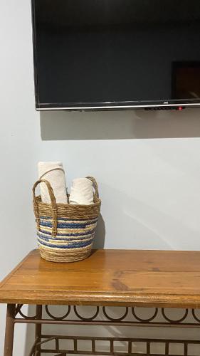 a basket of towels sitting on top of a table at Posada Regional in Oaxaca City
