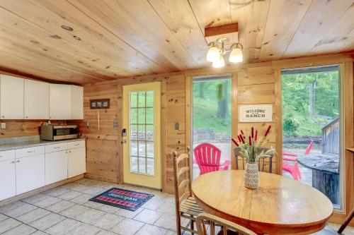 a kitchen and dining room with a table and chairs at Mountain-View Cabin on Farm 3 Mi to Town and Shops in Mountain View