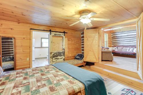 a bedroom with a bed and a ceiling fan at Mountain-View Cabin on Farm 3 Mi to Town and Shops in Mountain View