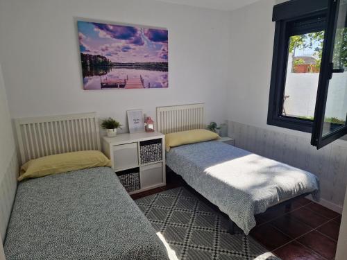 En eller flere senge i et værelse på Villa caracol