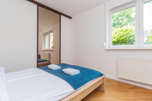 Postel nebo postele na pokoji v ubytování Molo Centrum by Grand Apartments