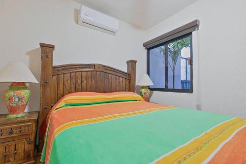 a bedroom with a large bed and a window at Casita Luna Sol in La Paz