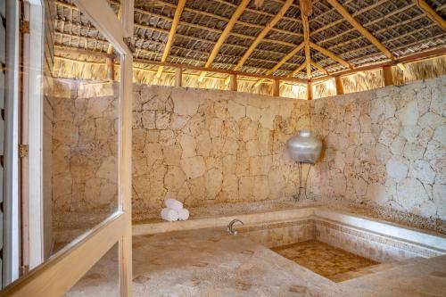 a bath room with a tub in a room at Sanctuary Cap Cana, a Luxury Collection Resort, Dominican Republic, Adult All-Inclusive in Punta Cana