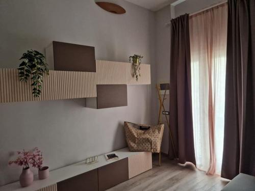 a living room with a desk and a chair at La Casa del Borgo in Peccioli