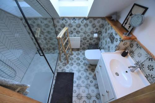 a bathroom with a sink and a toilet at Domek na Kaszubach 29-1 - Ostoja Bukowo in Borowy Młyn