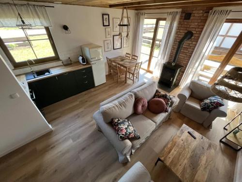 an overhead view of a living room with a couch at Domek na Kaszubach 33-2 - Ostoja Bukowo in Borowy Młyn