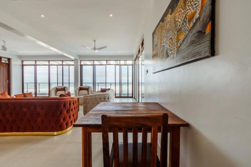 a living room with a table and a couch at YU Resort in Msambweni