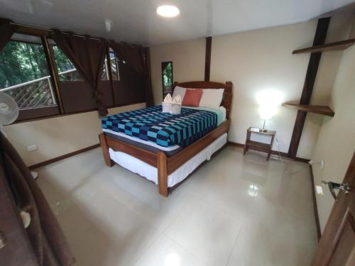 Una cama o camas en una habitación de Cool Waters Jungle Hostel